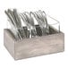 A Cal-Mil gray-washed pine wood flatware organizer with silverware inside.