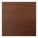 A close-up of a Perfect Tables dark walnut woodgrain table top.