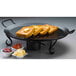 An American Metalcraft wrought iron griddle with french toast and butter on it.