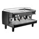 A black and silver Gaggia Vetro 3 group automatic espresso machine on a counter.