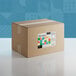 A cardboard box of Adourne Bold Confetti Sequin Sprinkles with a colorful label.