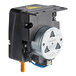 A black and silver Main Street Equipment Rinse Aid Pump with a round metal disc.