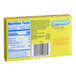 A yellow Lemonhead box with white and blue text on a counter.