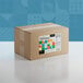 A cardboard box with a label for Adourne Mini Bold Confetti Sequin Sprinkles.