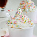 A cup of ice cream with Adourne Mini Pastel Confetti sprinkles.