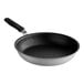 A black and silver Vollrath Wear-Ever fry pan with a black handle.