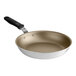 A close-up of a Vollrath Wear-Ever aluminum non-stick fry pan with a black handle.