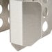 A stainless steel Nemco divider with holes.