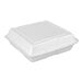 A white Dart foam take out container with a hinged lid.
