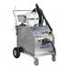 A Goodway heavy duty dry steam cleaner on wheels with twin boilers and a white container.