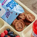 A package of Pillsbury Soft-Baked Mini Double Chocolate Cookies on a tray.