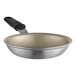 A Vollrath Wear-Ever aluminum non-stick fry pan with a black silicone handle.