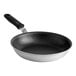 A close-up of a Vollrath Wear-Ever aluminum non-stick frying pan with a black silicone handle.