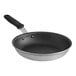 A close-up of a Vollrath Wear-Ever aluminum non-stick frying pan with a black handle.