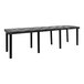 A long black rectangular Benchmaster display table with legs and a black top.
