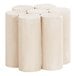 A group of four white Cal-Mil wooden cylindrical display risers stacked on top of each other.