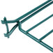 A close up of a green metal Metroseal shelf divider.