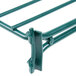 A close-up of a green Metroseal wire shelf divider.