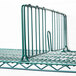 A green wire rack with a Metroseal 3 divider clip.