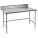 An Advance Tabco stainless steel work table with an open base.