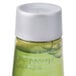 A close-up of a green Basic Earth Botanicals body wash bottle with white text.