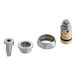 A group of Chicago Faucets brass and metal parts including a silver metal nut.