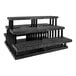 A black plastic Benchmaster five step pyramid display.