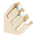 A Cal-Mil maple wood countertop cup and lid organizer with three sections holding cups.