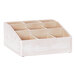 A white wooden Cal-Mil condiment organizer with compartments.