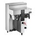 A silver Fetco CBS-1232 Plus Series coffee machine with two metal brew baskets on top.