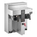 A Fetco CBS-1232 Plus coffee machine with buttons and a screen.