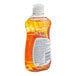 A close up of a bottle of JoySuds orange dishwashing liquid.