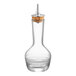 A clear glass Barfly bitters bottle with a cork top.