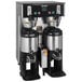 A Bunn BrewWISE dual coffee brewer with silver and black containers.