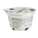 A close up of a white Chobani yogurt cup with blue and black text.