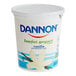 A white container of Dannon Low-Fat Vanilla Yogurt with blue and white text.