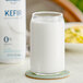 A glass of Lifeway Non-Fat Plain Kefir on a coaster.