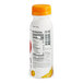 A white Chobani bottle with an orange cap.