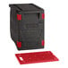 A black CaterGator front loading plastic food pan carrier with a red hot board inside.