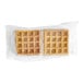 Two Krusteaz Belgian waffles in plastic bags.