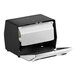 A black metal Dixie tabletop napkin dispenser with a silver faceplate.