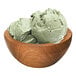 A bowl of G.S. Gelato green tea gelato on a table.