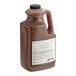 A jug of Dona Original Masala Chai concentrate, a gallon of brown liquid.