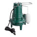 A green and white Zoeller M267 automatic sewage pump with a hose attached.