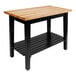 A black wooden John Boos work table with undershelf and casters.