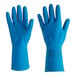 A close-up of a pair of blue Ansell AlphaTec rubber gloves with fish scale grip.