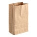 A brown paper bag with a handle.