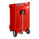 A red rectangular HDPE plastic container with wheels and a hose.