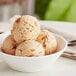 A bowl with three scoops of Eclipse Foods vegan cookie butter ice cream.