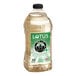 A plastic bottle of Lotus Plant Power White Lotus Energy Concentrate with a green label.